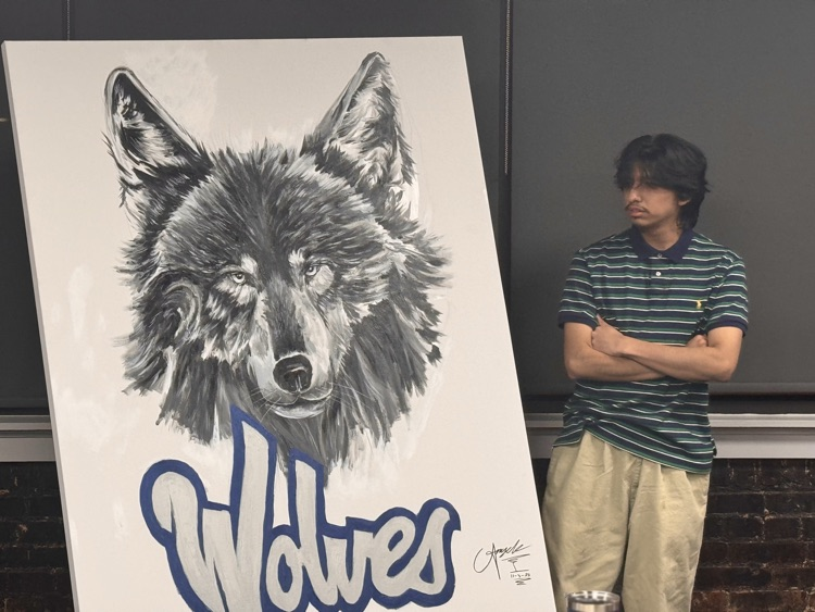 man standing with his painting of wolf