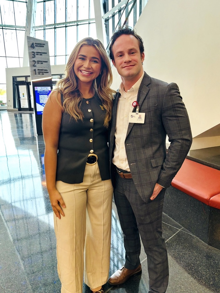 man and women in business attire posing
