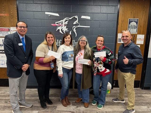 group of adults smiling 