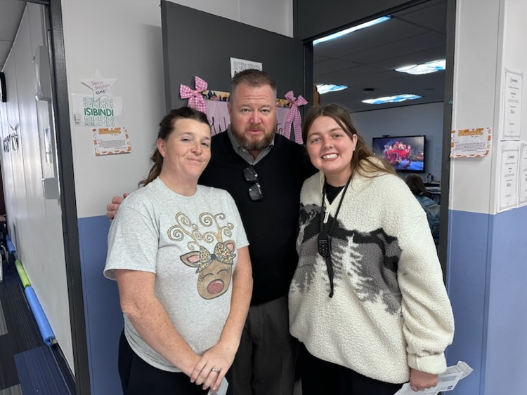 group of adults smiling 