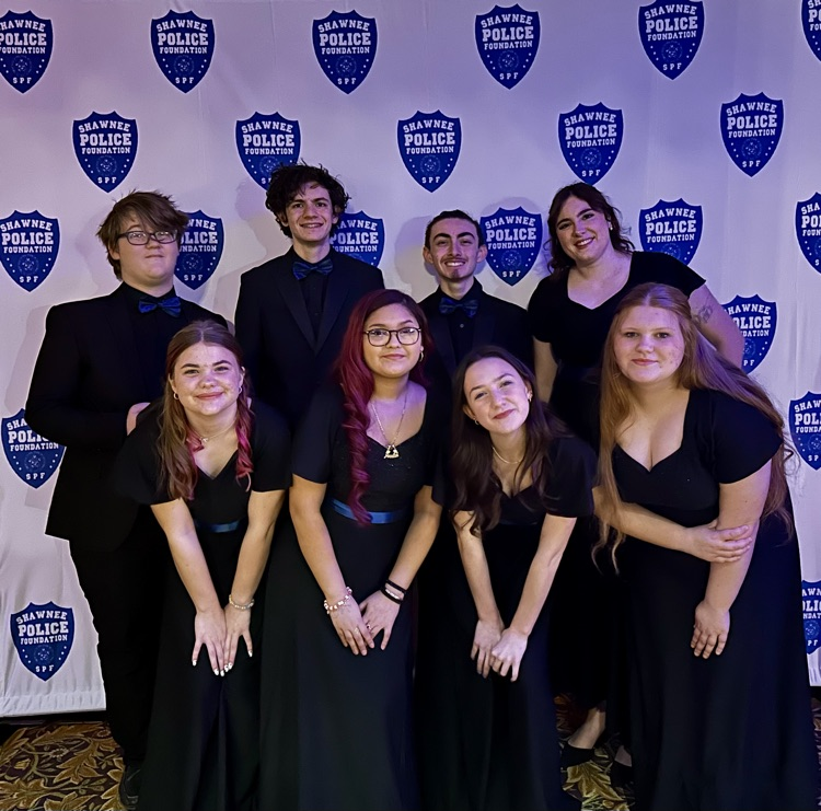 students in black attire posing