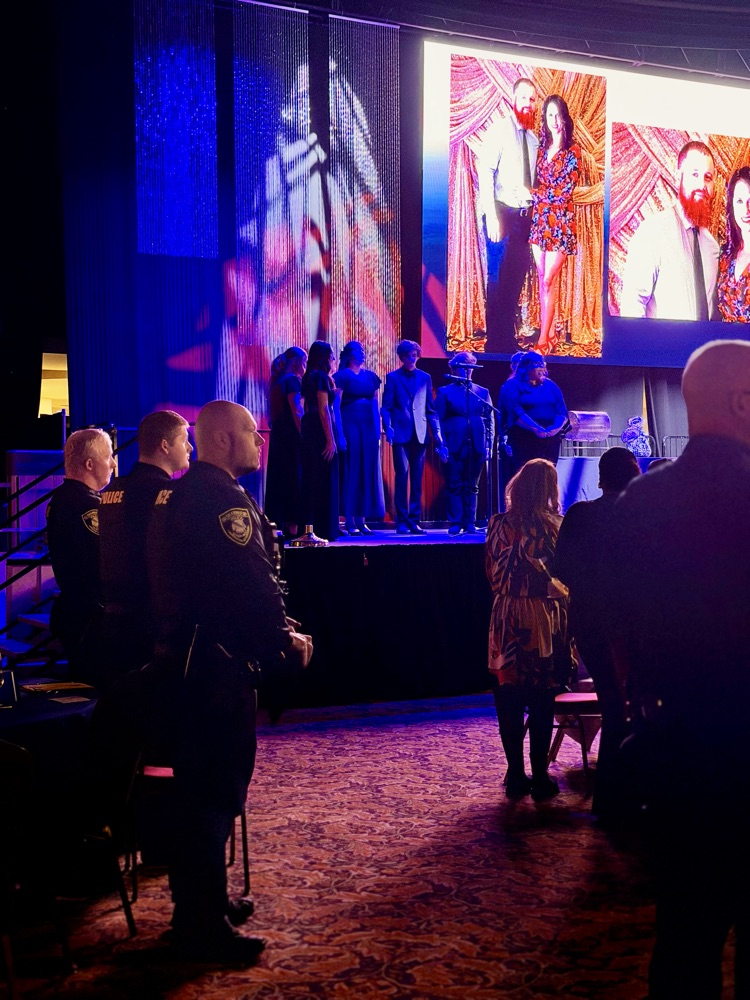 students singing on stage