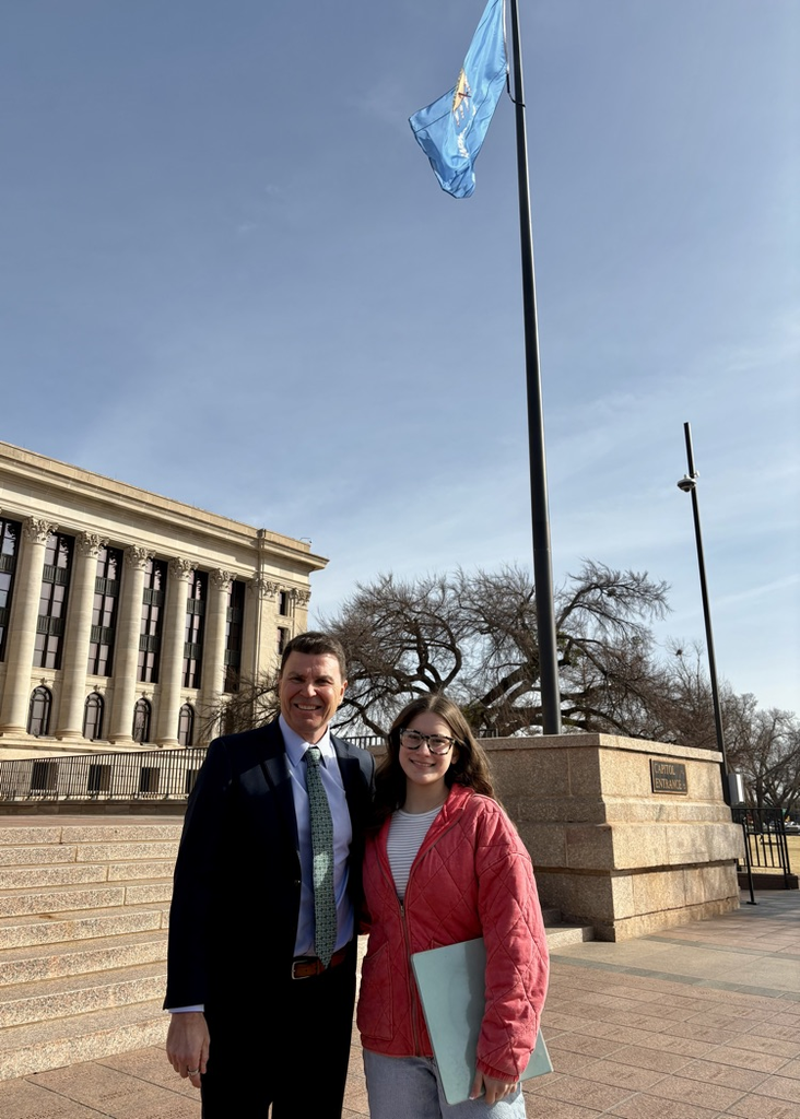 man and teenage girl outside Capitol
