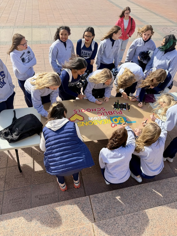 group of students signing poster