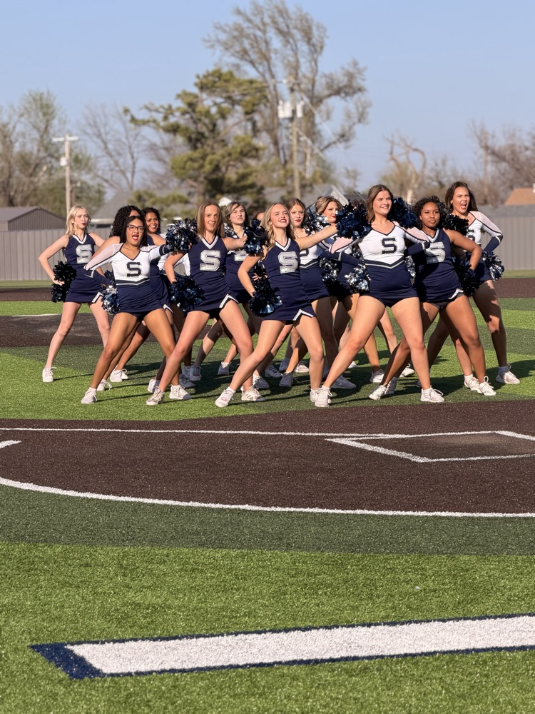 Pom and cheer performing on baseball field 