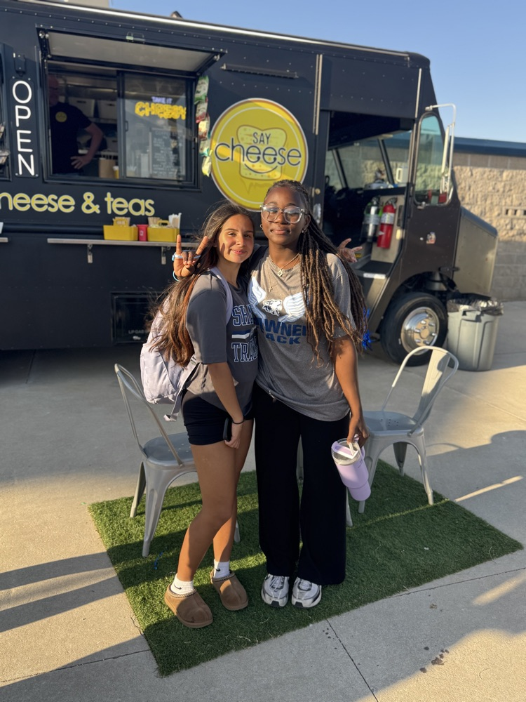 two girls in front of food truck