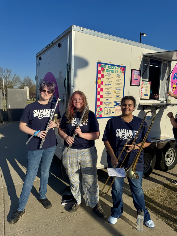 band members in front of food truck