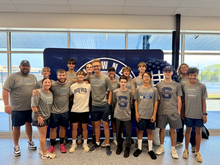 group of teens in front of backdrop 