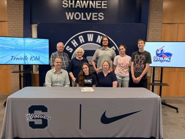 student with family for signing 