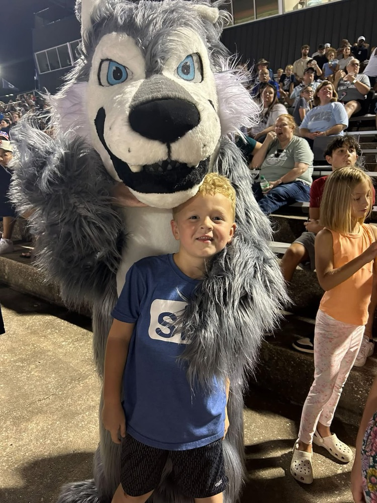 wolf mascot with student