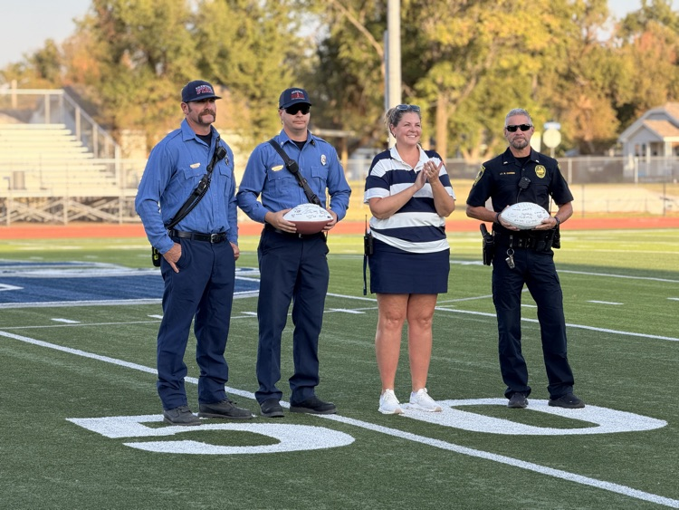first responders recognized on football field