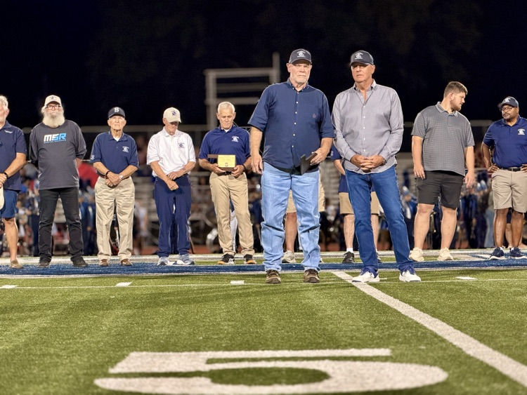 men standing on football field