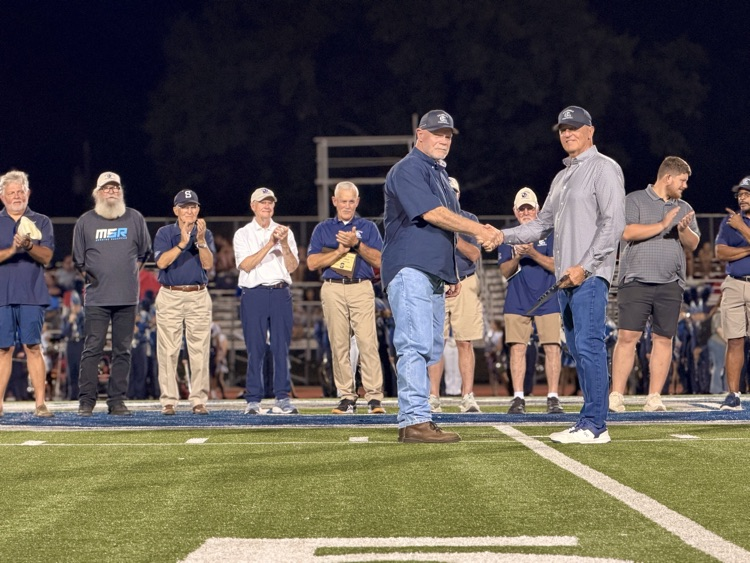 men standing on football field