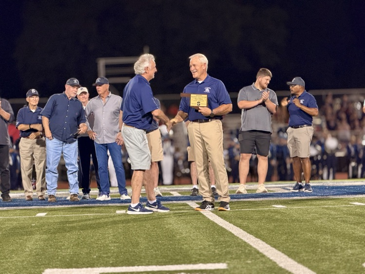 men standing on football field
