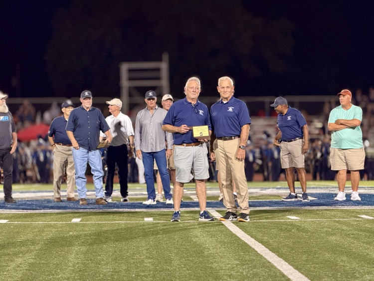 men standing on football field