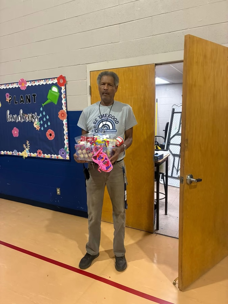 man in gray holding a basket for celebration 