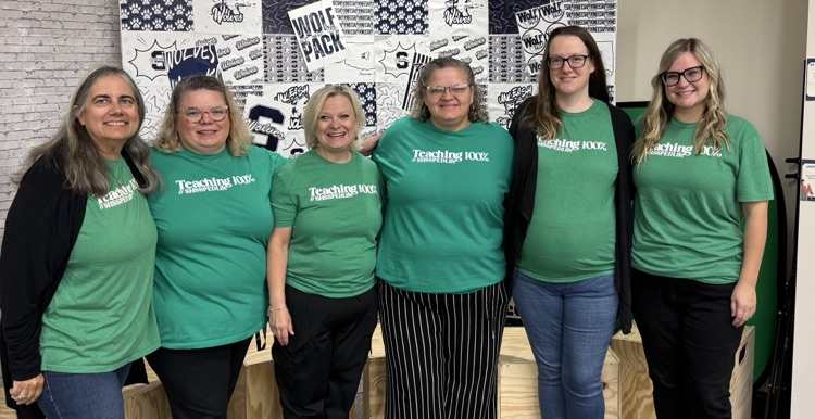 women in matching green shirts 