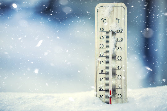 Outdoor thermometer in snow.