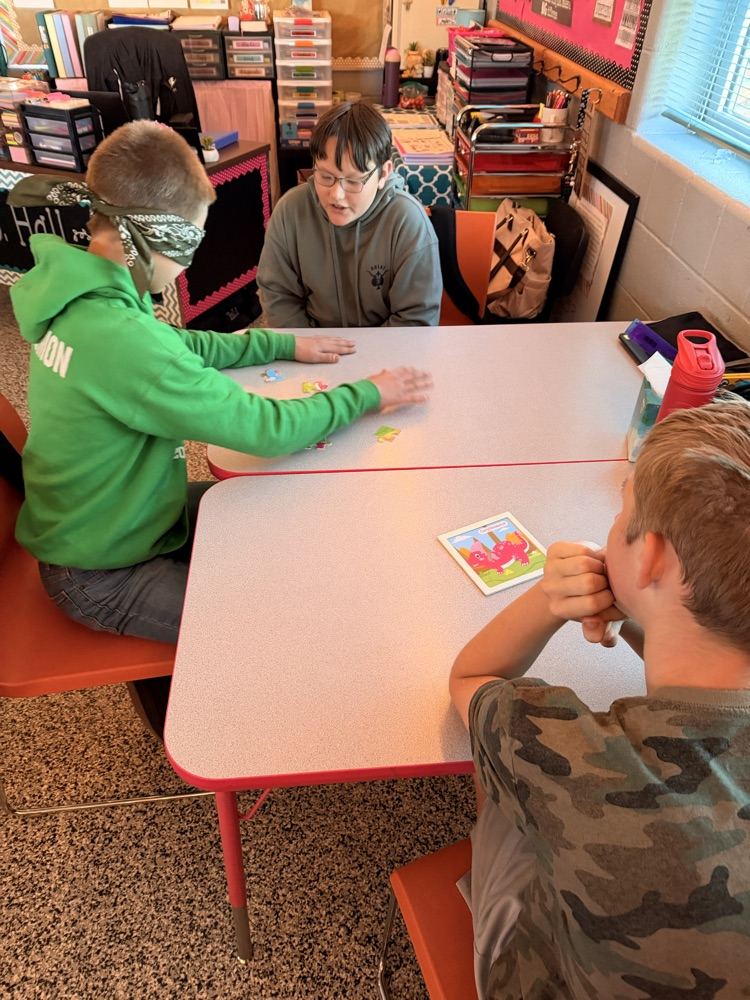 student putting together a puzzle while blindfolded
