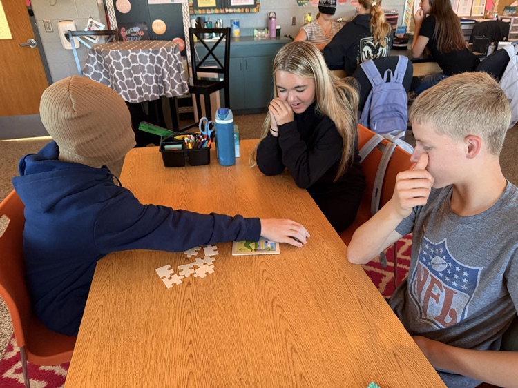 student putting together a puzzle while blindfolded