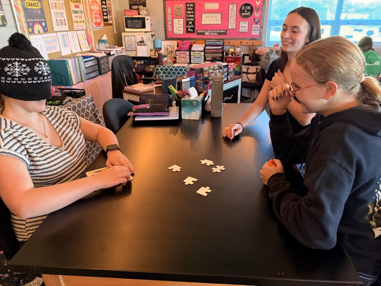 student putting together a puzzle while blindfolded