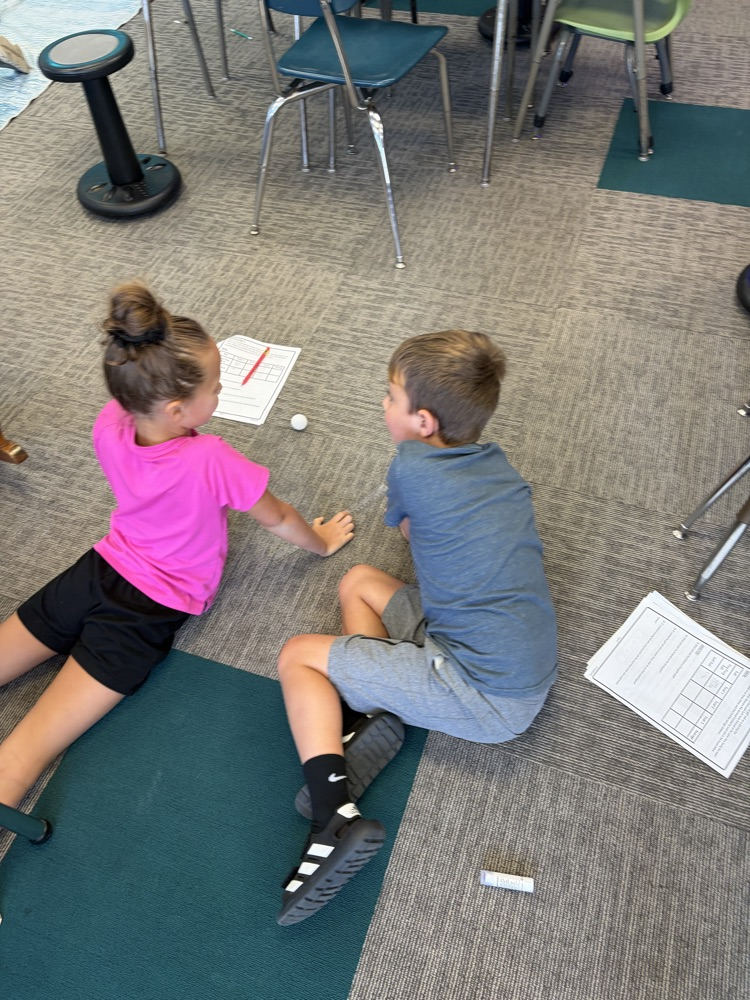 students discussing science