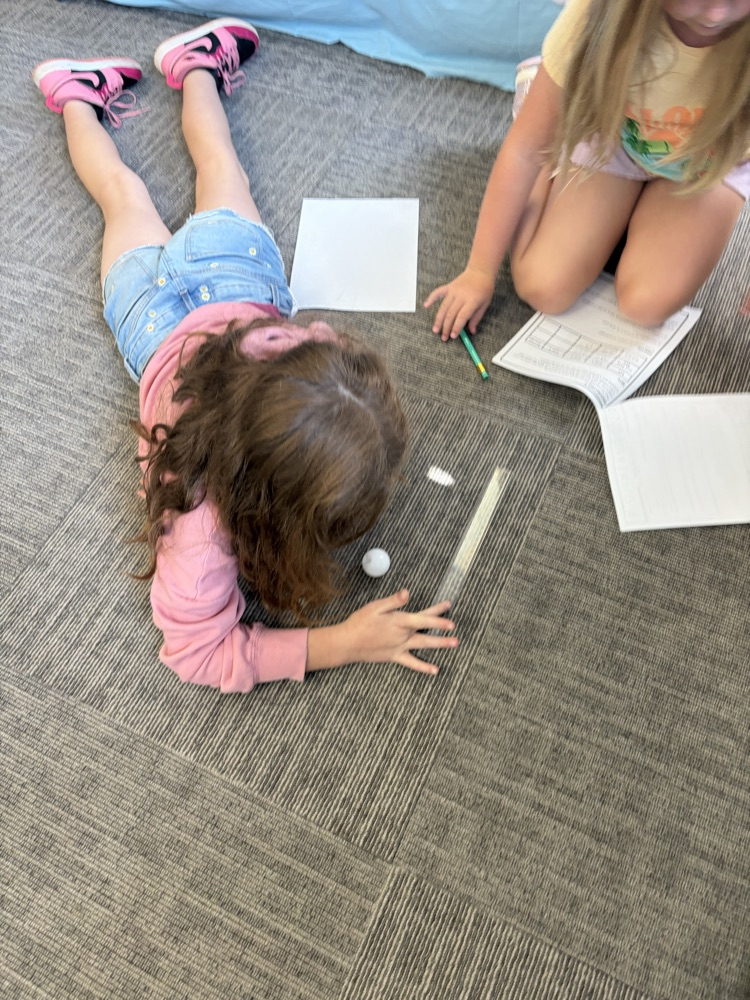 students measuring distance