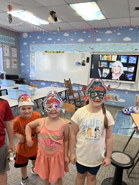 Students wearing pirate hats and masks. 