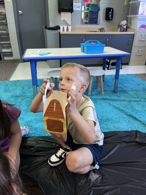 Young student with a treasure box.