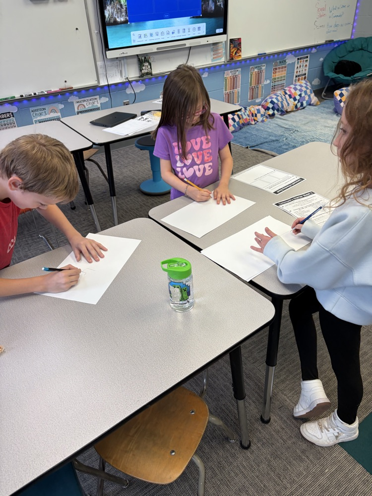 Students working together on community paper