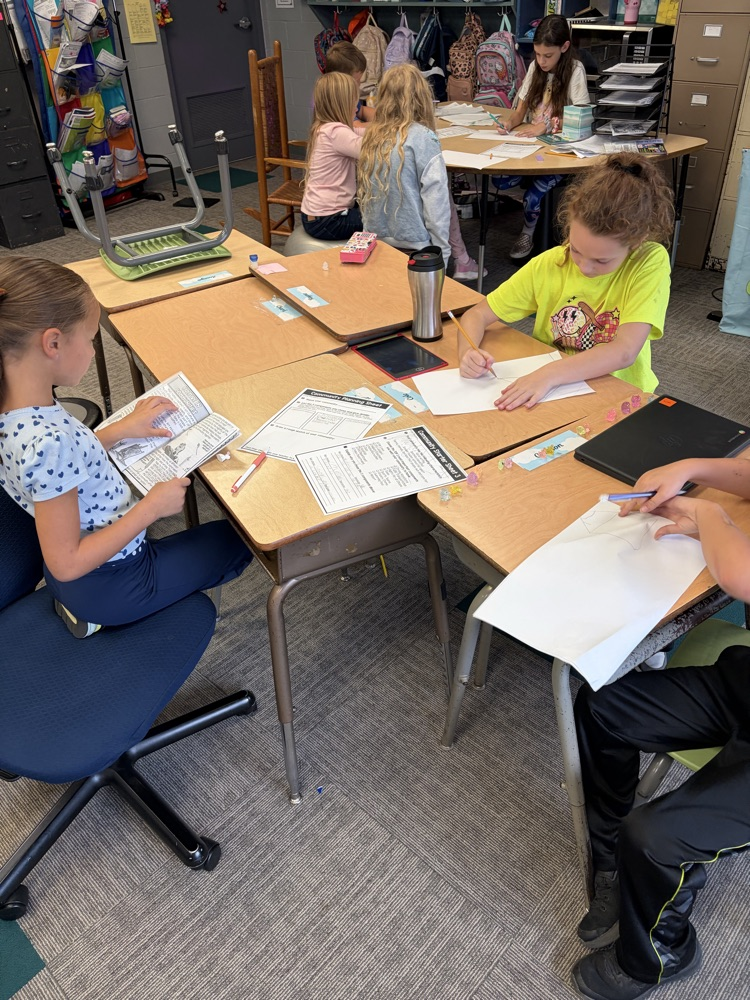 Students working together on community paper
