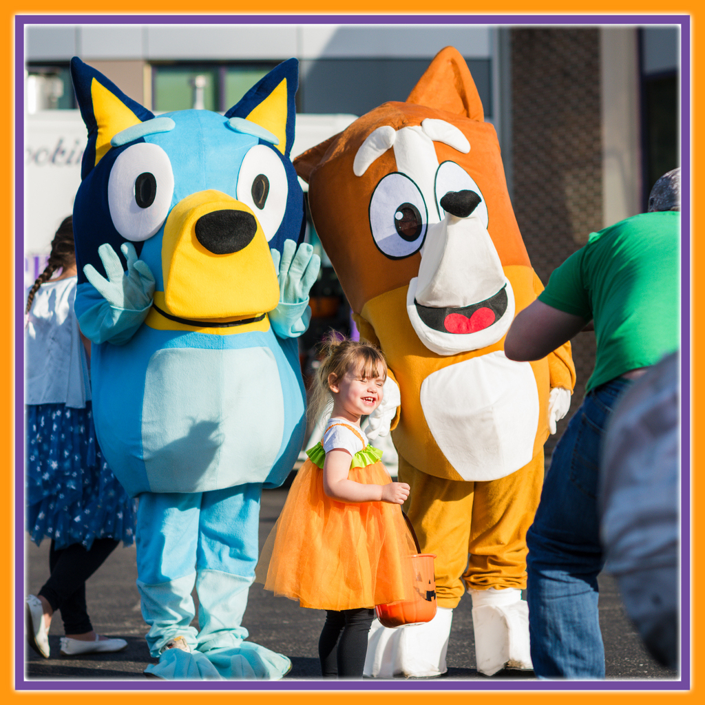 A Child Smiling with Bluey charcters 