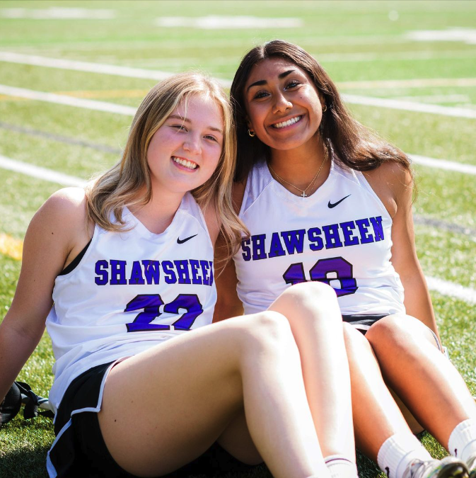 Two soccer students #22 and  #10 smiling at the camera 