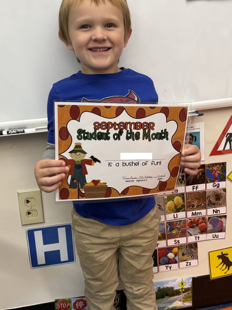 little boy holding certificate