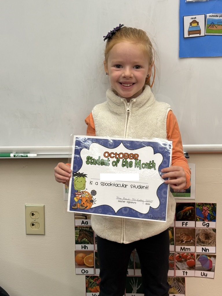 student holding certificate