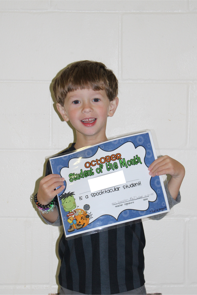 student holding certificate