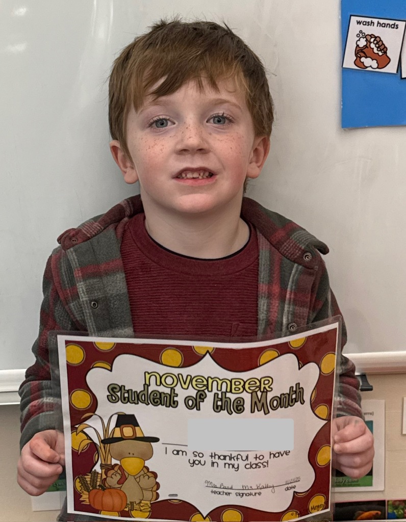 student holding certificate