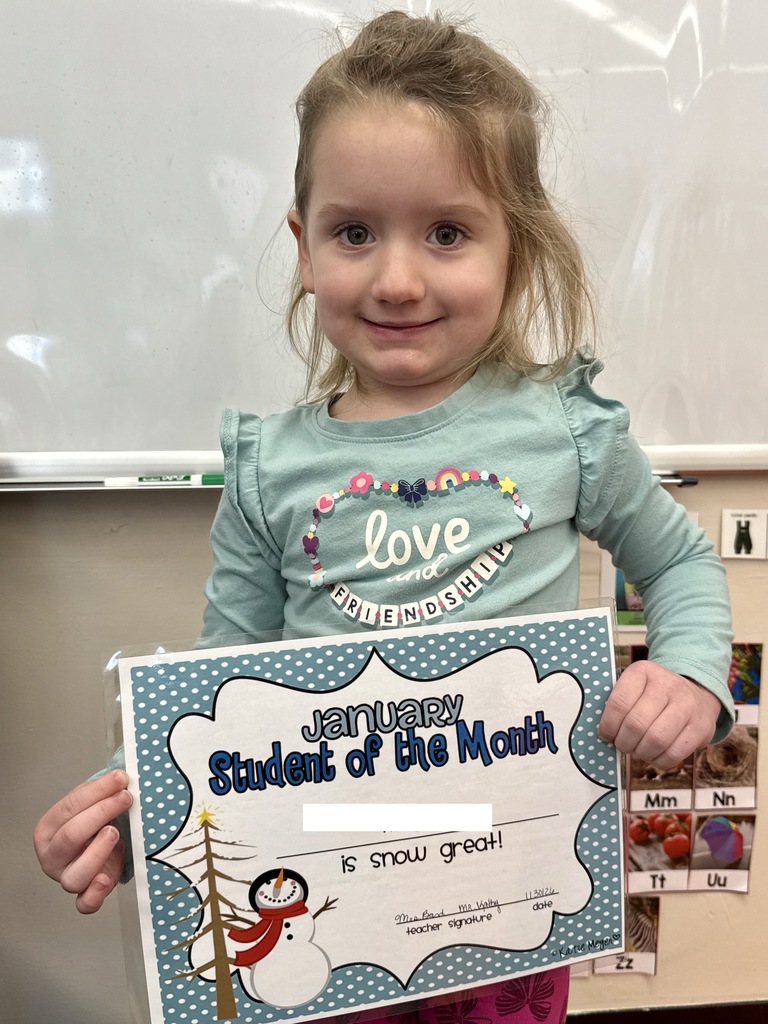 little girl holding certificate