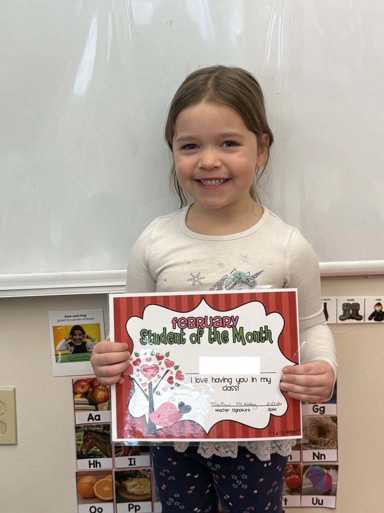 student holding certificate