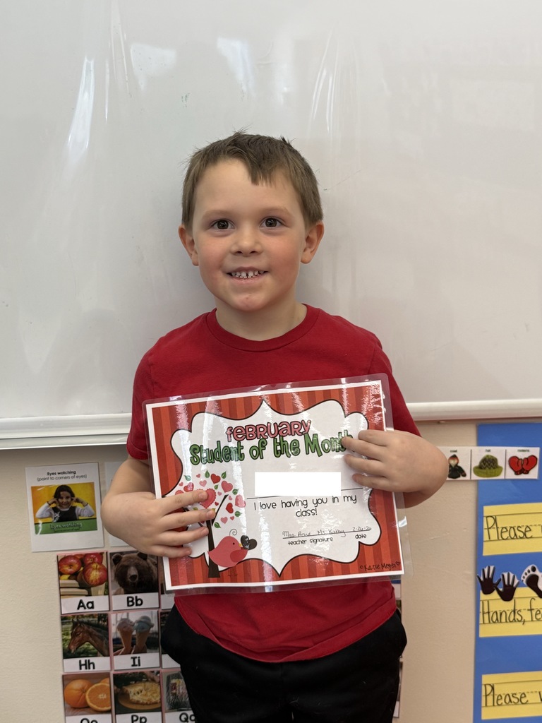 student holding certificate