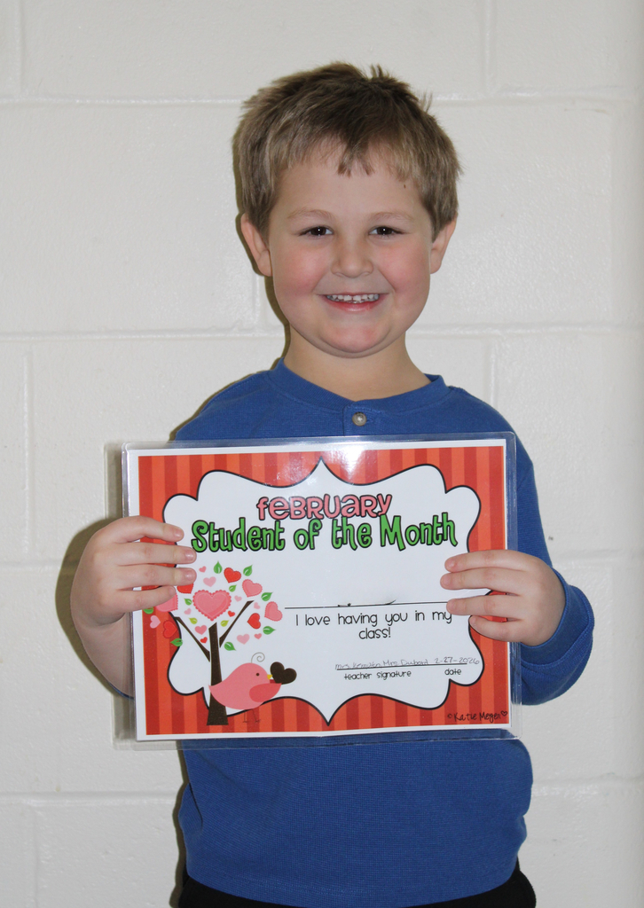student holding certificate