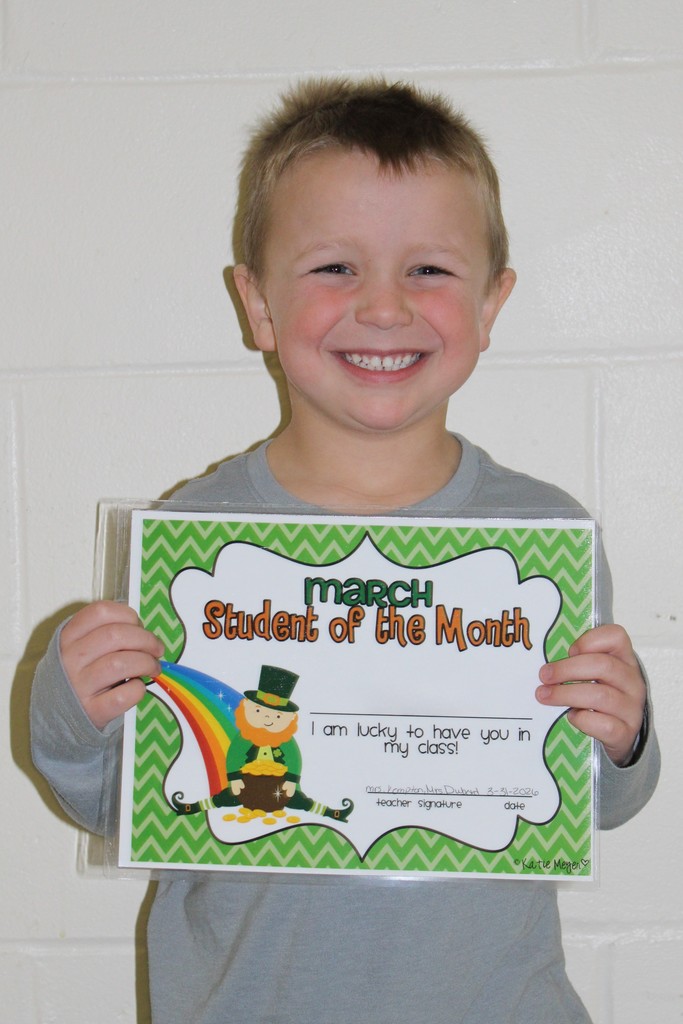 little boy holding certificate