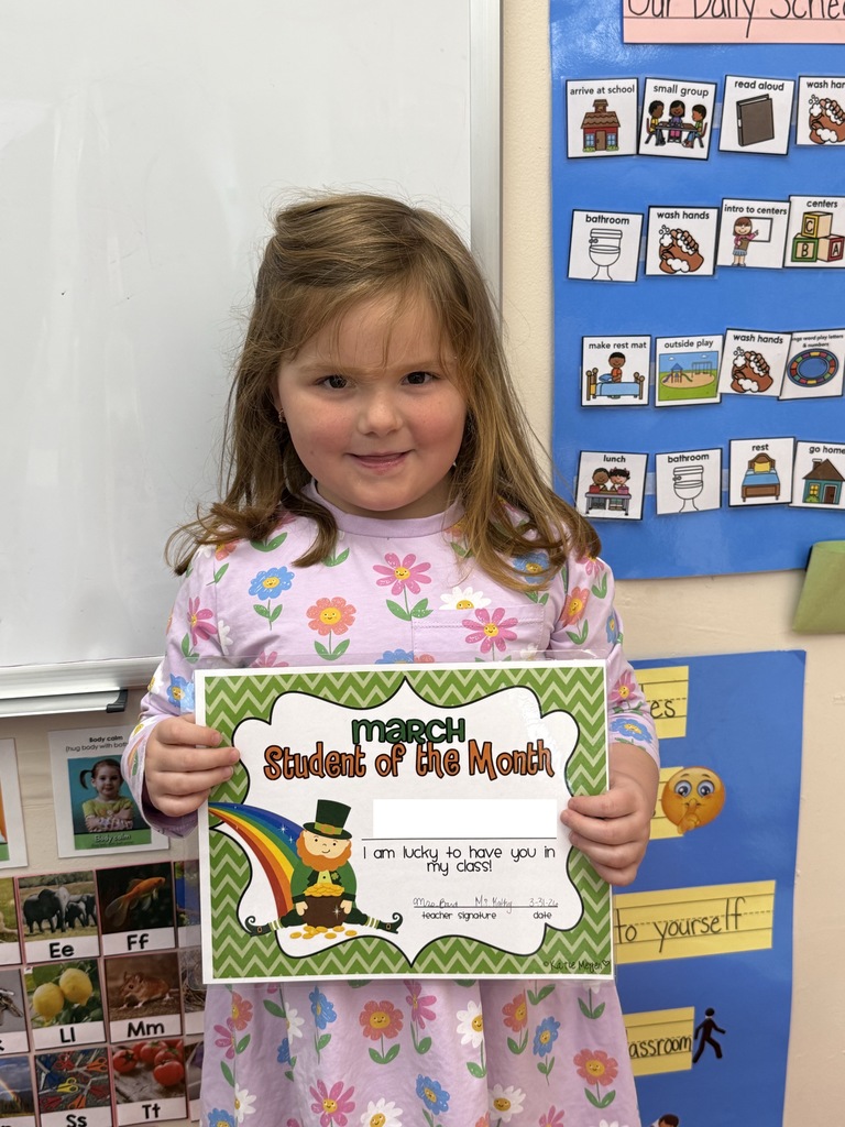 little girl holding certificate