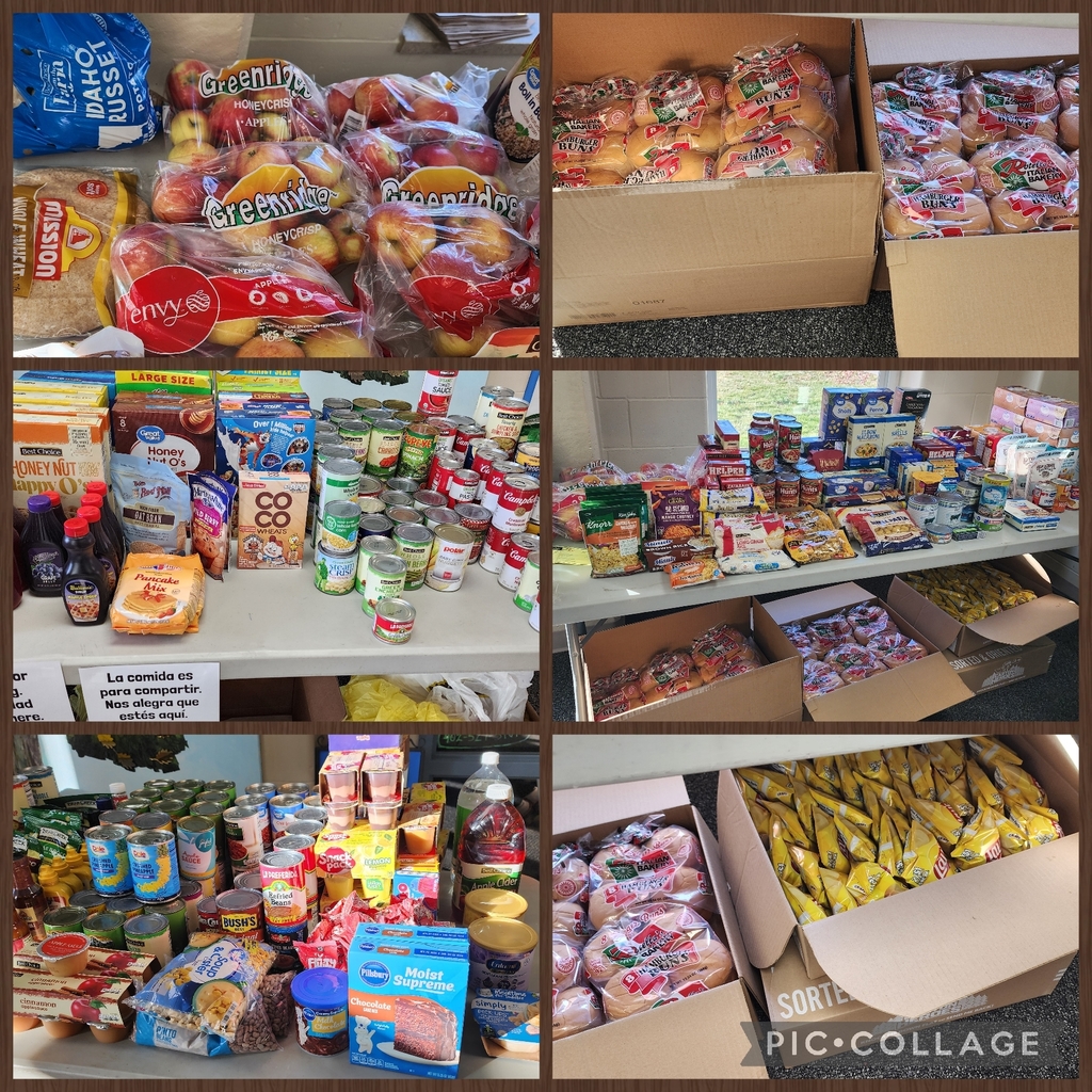 A collage of six photos showing a well-stocked temporary food bank with a variety of donated items. Top left: several bags of apples labeled “Honeycrisp,” “Greenridge,” and “Envy.” Top right: boxes filled with hamburger and hot dog buns. Middle left: shelves of canned goods, cereals, and pantry staples with a bilingual sign reading “La comida es para compartir” (“The food is for sharing”). Middle right: tables filled with boxed meals, pasta, and more canned goods. Bottom left: an assortment of nonperishable foods including canned beans, fruit cups, pancake mix, and baking ingredients. Bottom right: large boxes containing bread and individual bags of chips. The overall scene highlights abundance and community support.