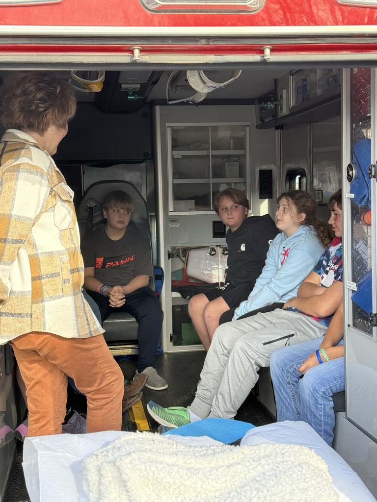 Shelby VFD’s John Eller and Denise Humlicek guide 6th grade Explore students through an ambulance tour.