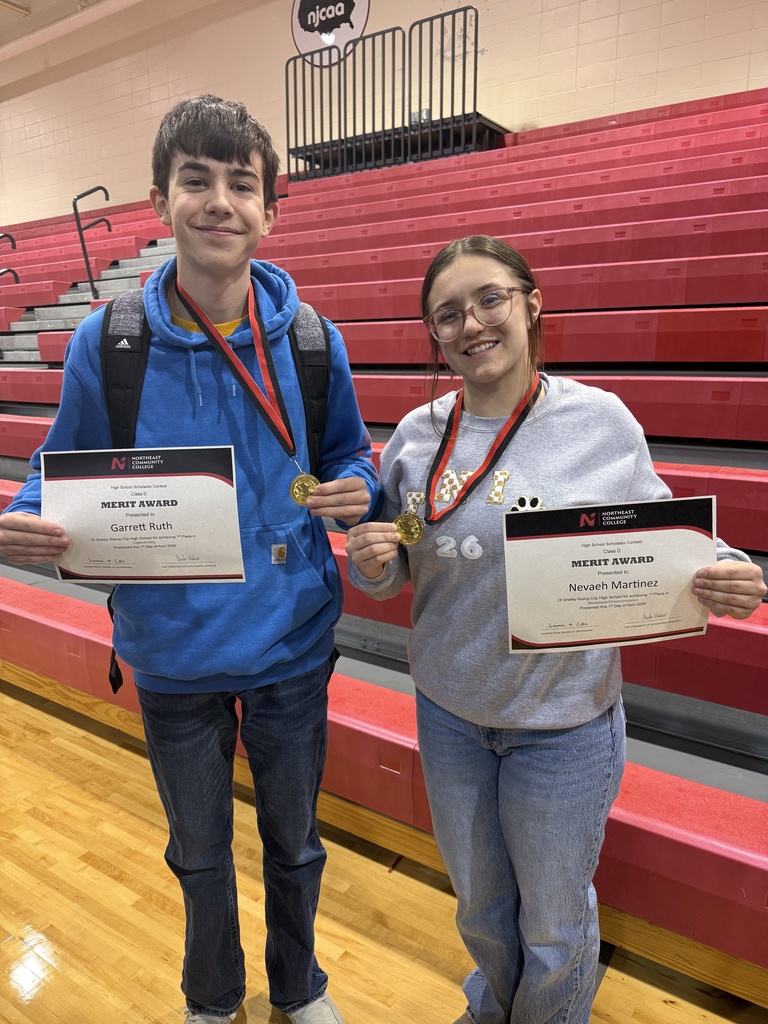 Garrett Ruth is shown on the left with his first place certificate  and mdeal and Nevaeh Martinez is on the right showing her first place certificate and medal.