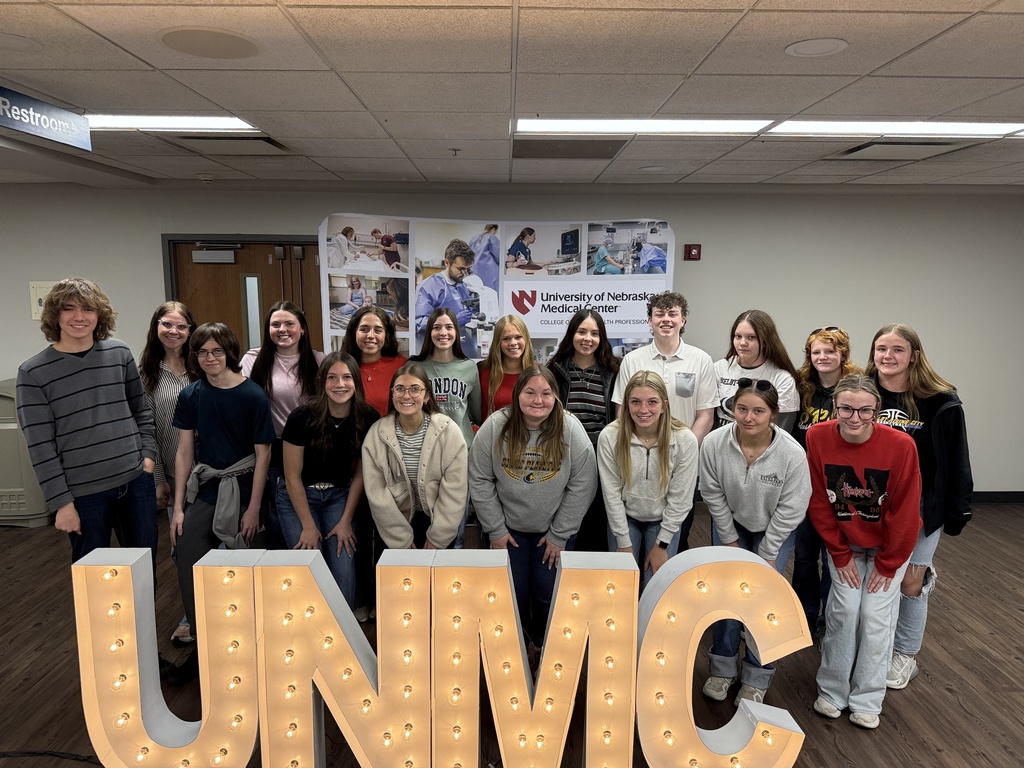 Students pose by the UNMC props.