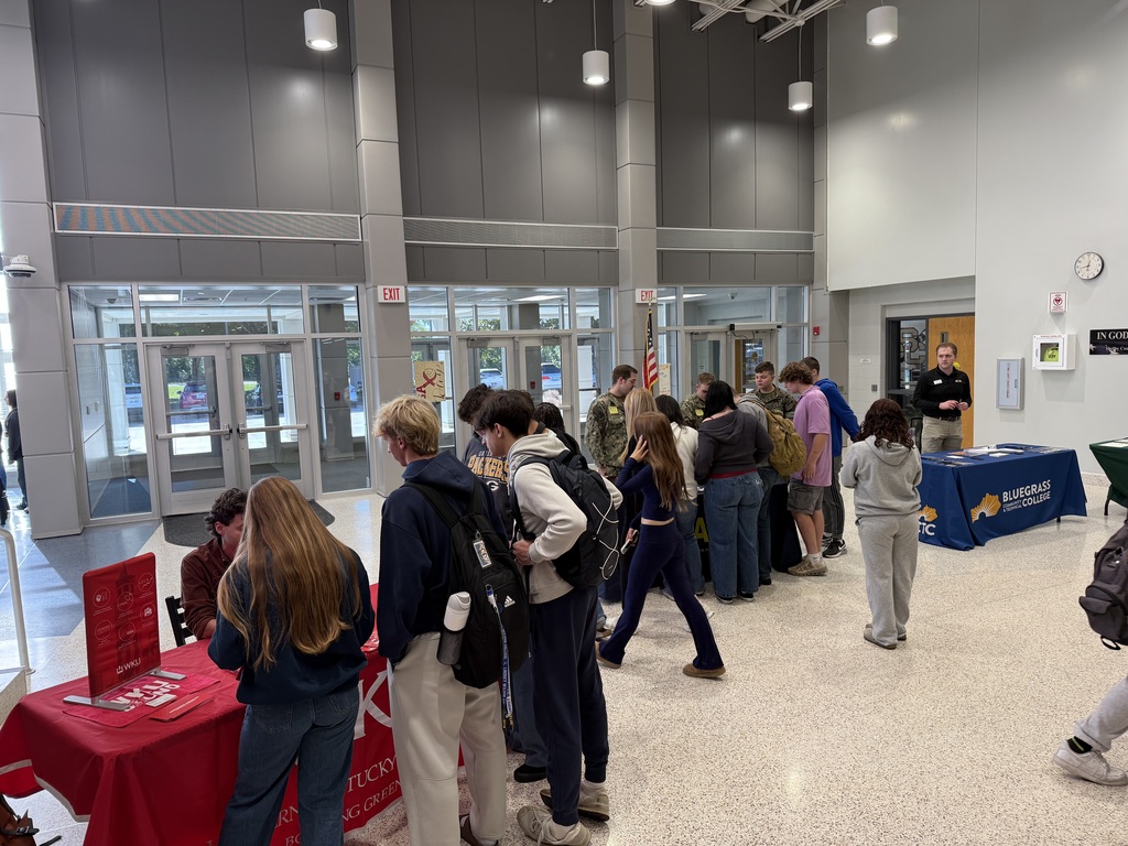 WKU, Navy, BCTC, and KSU representatives talking to students. 