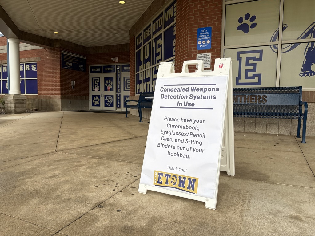 A sign at EHS informing about their weapons detection systems