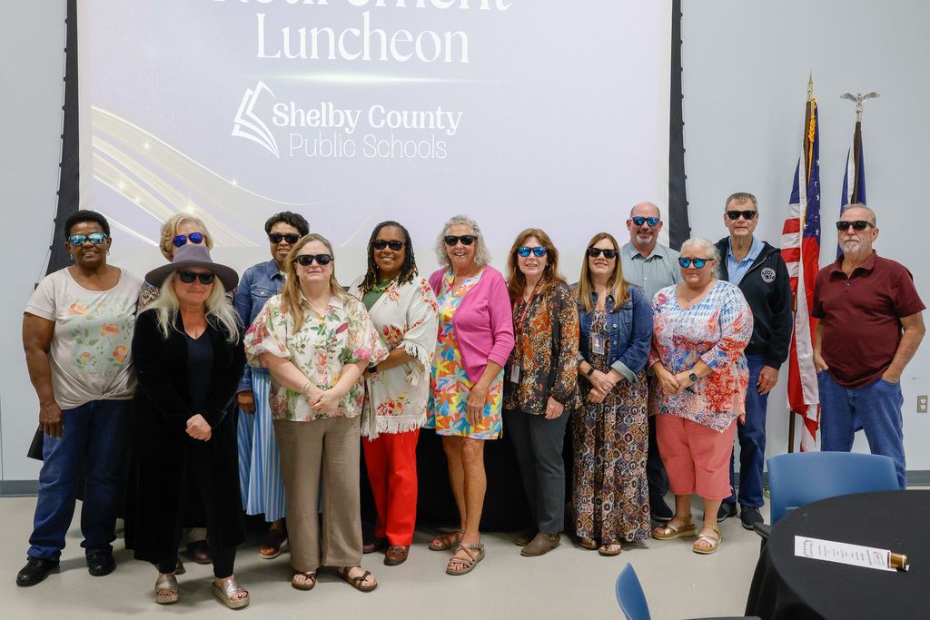 The SCPS Retirees posing together with their new sunglasses on